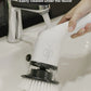 IPX7 waterproof cleaning brush being rinsed under faucet for easy maintenance